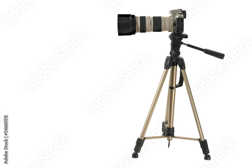 The camera with the big lens on a support on a white background