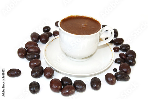 coffee in the white cup and peanut in chocolate