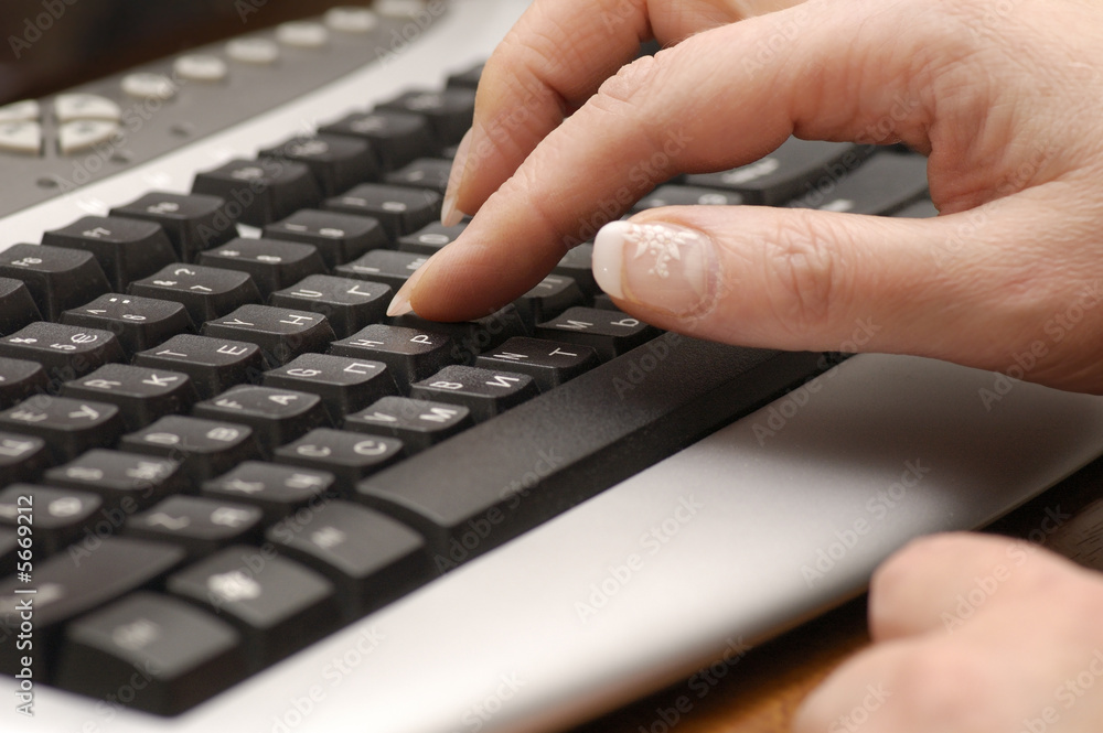 woman fingers on computer keyboard woman fingers on computer keyboard