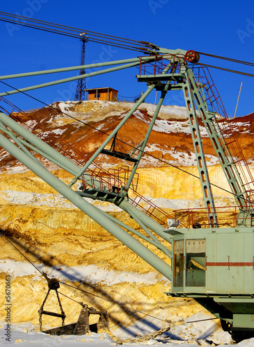Observant post on a background of an arrow of a walking dredge
