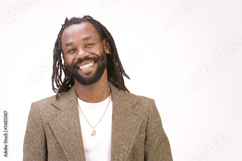 A black man with dreadlock hair isolated on a white background.