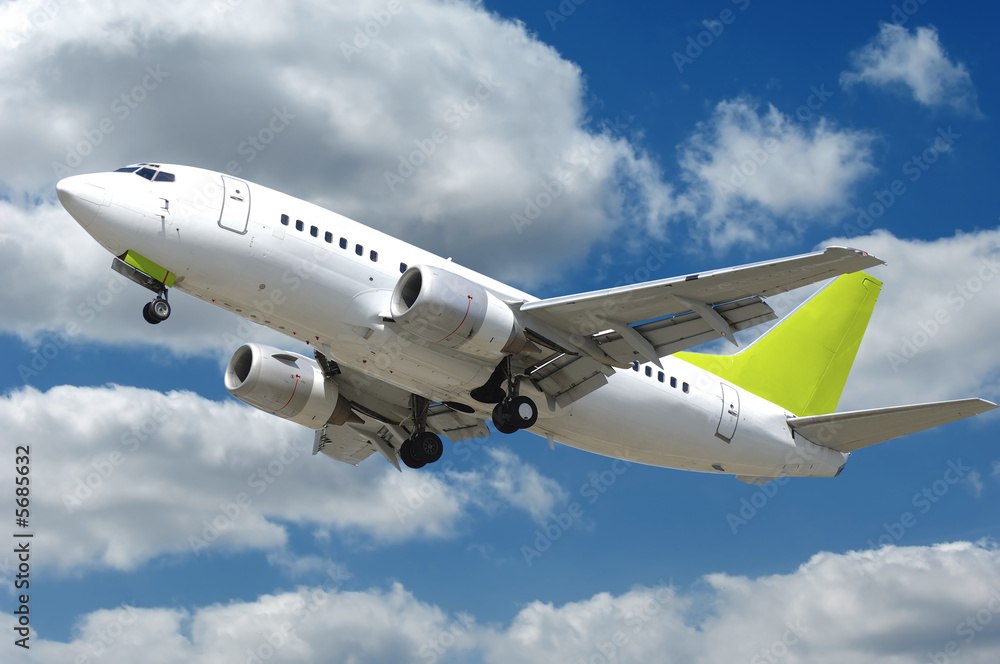 Commercial jet plane takkeoff with many clouds Commercial jet plane takkeoff with many clouds