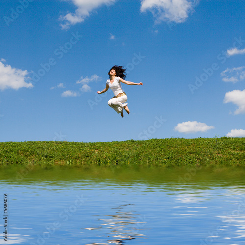 happy young woman is jumping