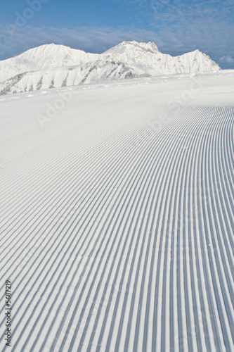 Snow grooming machine tracks photo