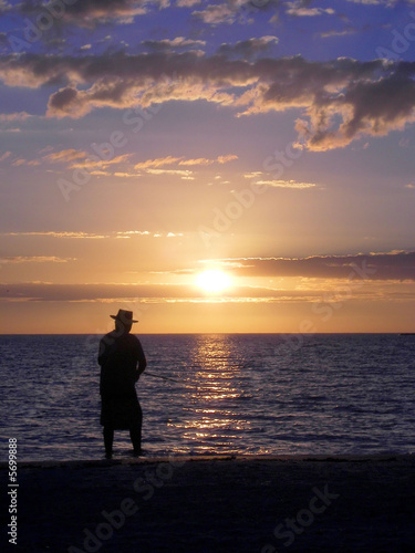 old man fishing at sunset © J Hindman