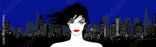 Young pretty woman on an urban background
