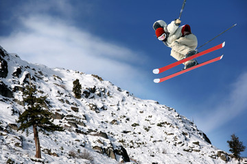 A young man jumping high at Lake Tahoe resort
