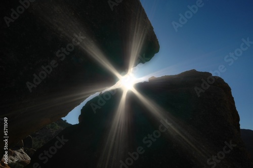 Sun beams breaking through the rock formations.
