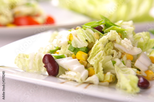 Fresh salad with corn and basil