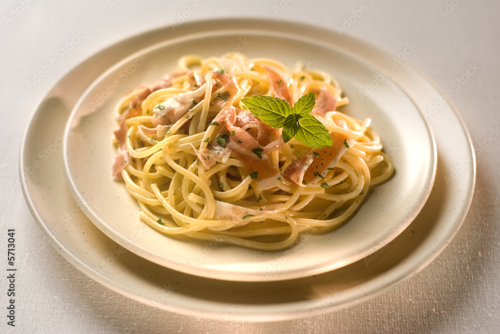 spaghetti with cheese and prosciutto close up shoot