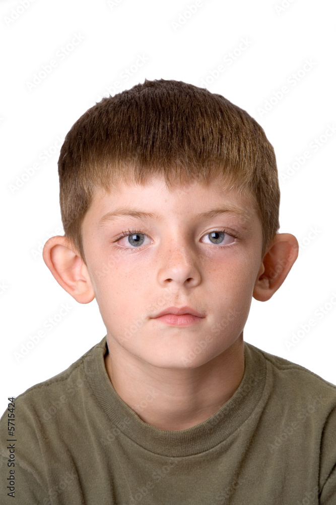 Young boy isolated on a white background looking bored Young boy isolated on a white background looking bored