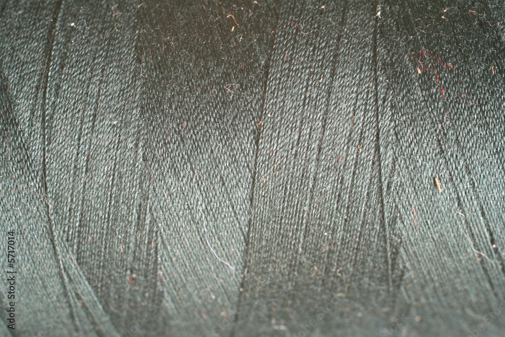 Fototapeta premium grey thread fabric wool yarn wrapped in a spool