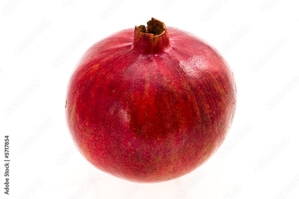 Ripe red pomegranate on a white background Ripe red pomegranate on a white background