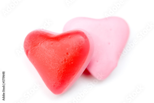 Close up red and pink candy hearts isloated on white