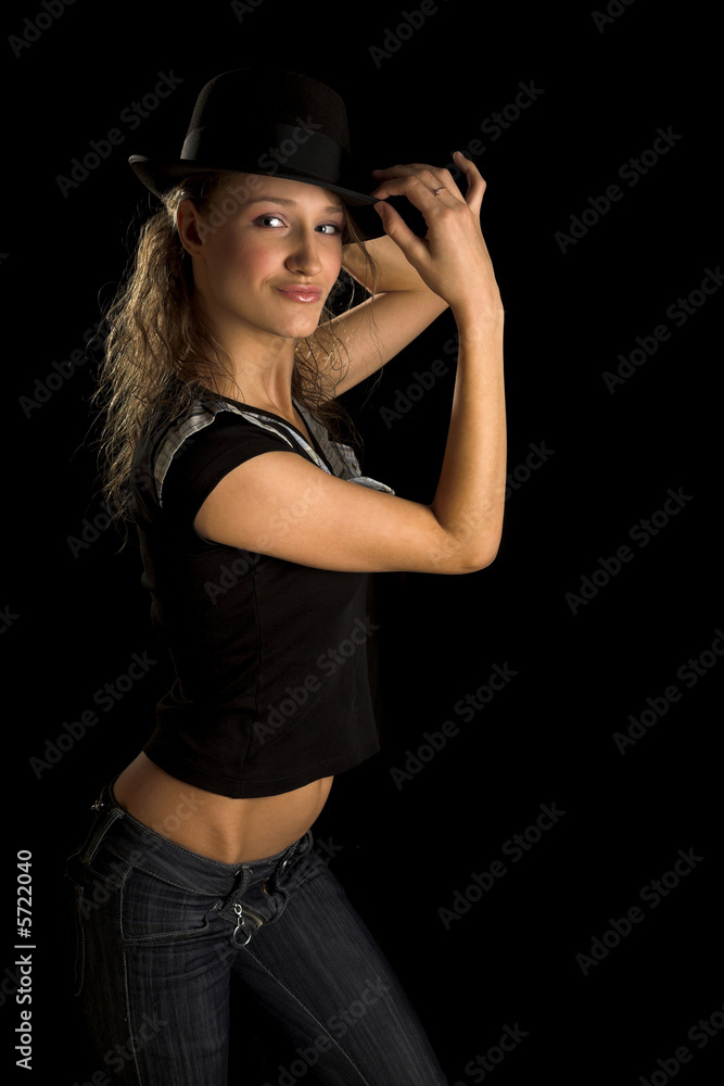 young woman in black hat on black young woman in black hat on black