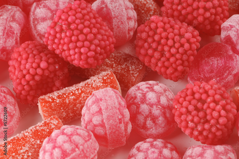 a close-up of various pink and red candy a close-up of various pink and red candy