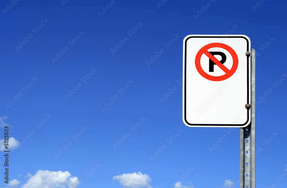 No parking sign with copy space against the blue sky. No parking sign with copy space against the blue sky.