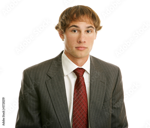 Young businessman with blank expression. 
