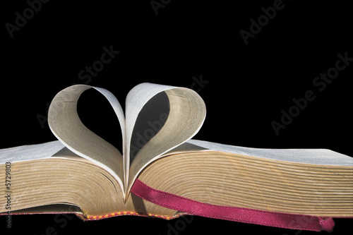 Pages of a book folded in to a heart shape.