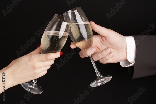 man and woman celebrating with Champagne, toast, party time