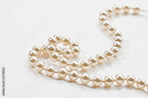White beads on a white background, Venetian pearl