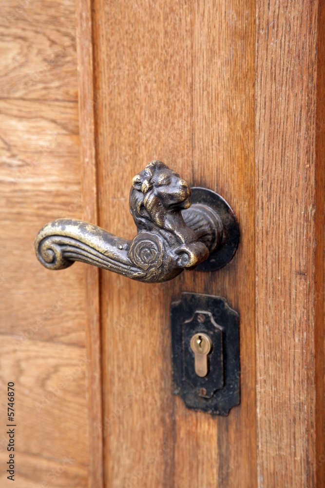 The old metal handle of a door The old metal handle of a door