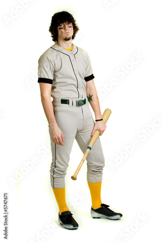 Photography A young male baseball player standing.