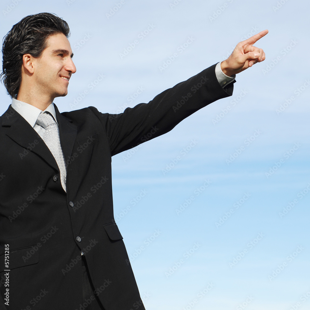 successful businessman is posing against the sky successful businessman is posing against the sky