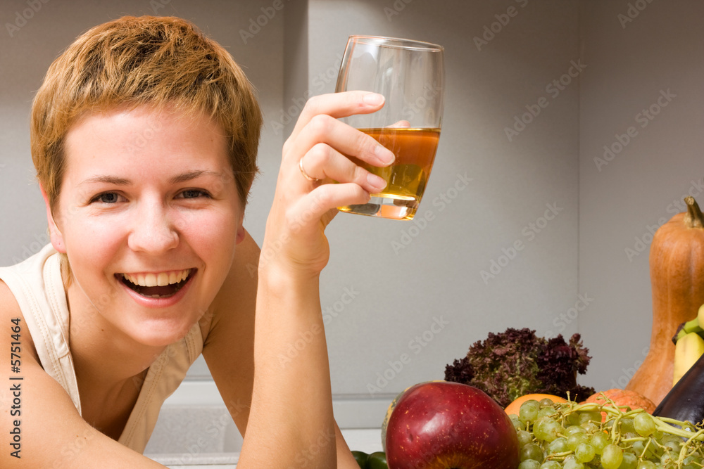 Beautiful woman with glass of juice and fresh fruits Beautiful woman with glass of juice and fresh fruits