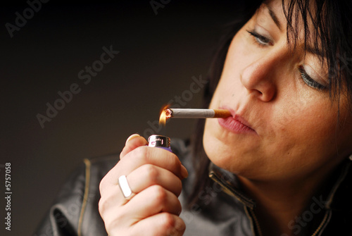 Wallpaper Mural A dark hair woman lighting up her cigarette Torontodigital.ca