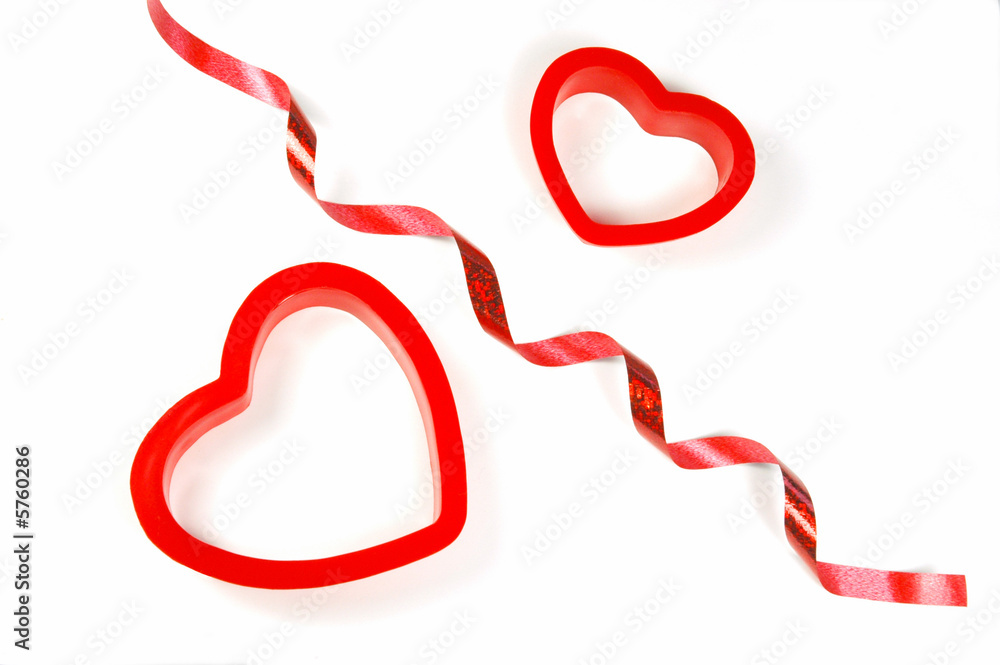 Heart-shaped cookie cutters and curled ribbon