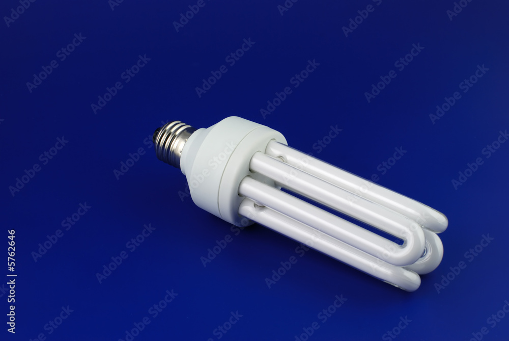 Lamp. An electric economic lamp on a dark blue background Lamp. An electric economic lamp on a dark blue background