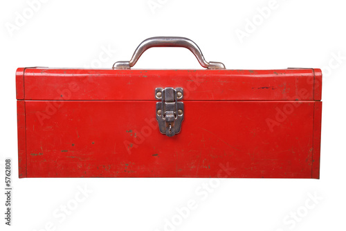Old used red toolbox over a white background