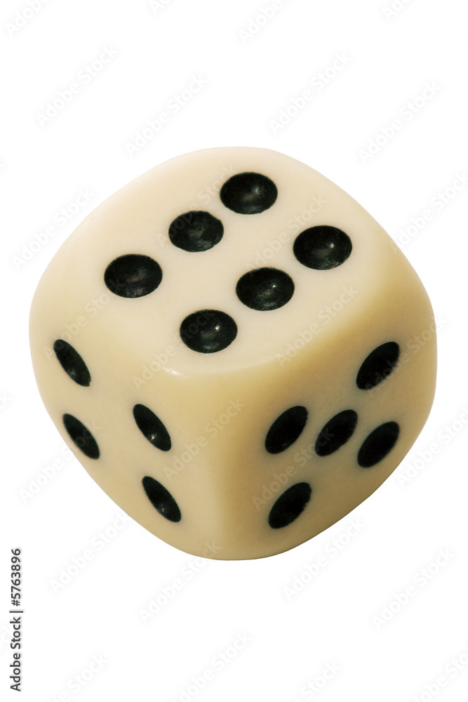 Old playing die on a white background