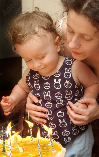 Boy with mother celebrating birthday