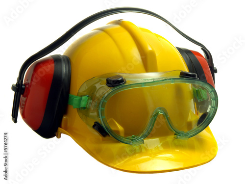 Safety helmet, goggles and ear defenders isolated on white