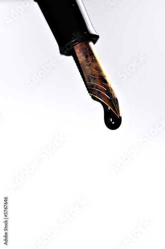 fountain pen spilling ink from golden tip