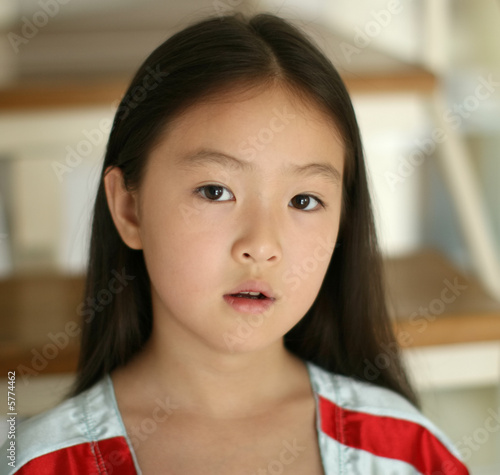 little girl sitting on stairs