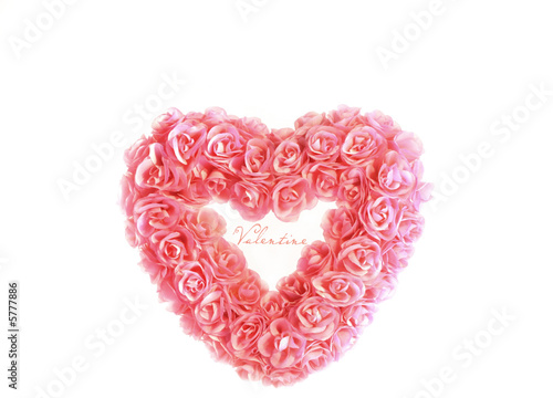 Heart with tiny pink roses isolated on white background