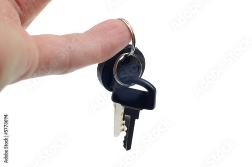 hand holding keys in the white background isolated.