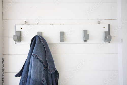 clothes rack with a jeans jacket in a beach cabin