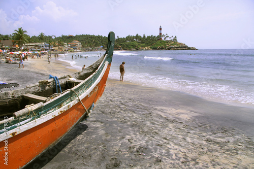 boat at crowded beach  kerala  india