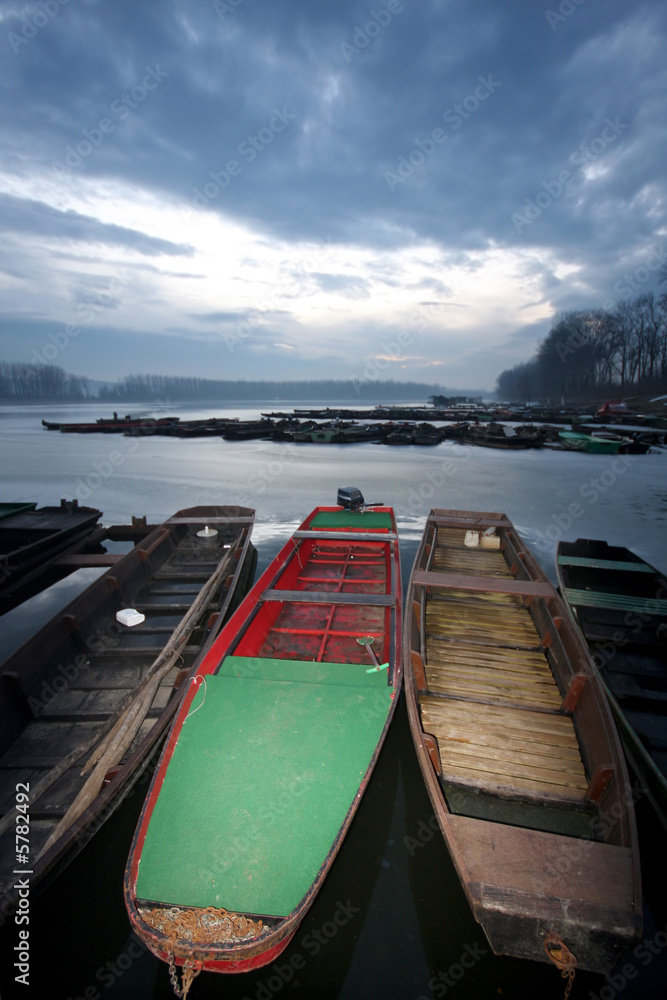 old boat on frozen river Danube in january old boat on frozen river Danube in january