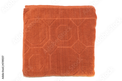 Orange turkish bath towel isolated on white background photo