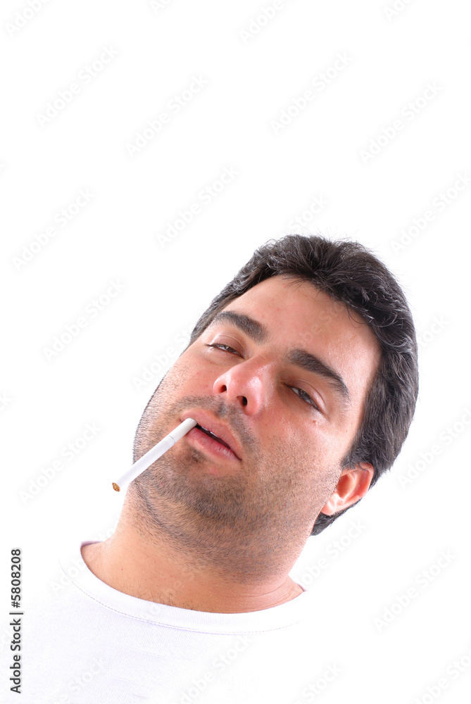 Obraz premium Young tired man with an cigarette in the mouth .