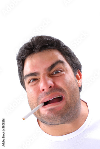Stressed man with an cigarret in the mouth .