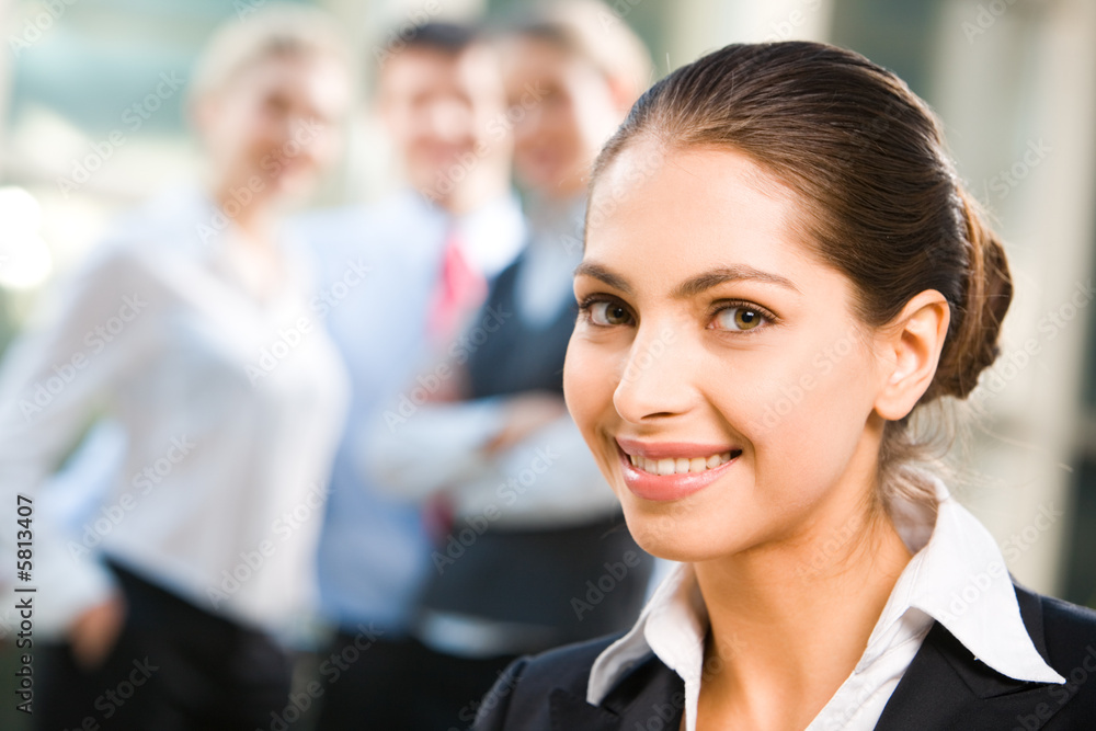 Attractive self-confident business lady with a happy smile Attractive self-confident business lady with a happy smile
