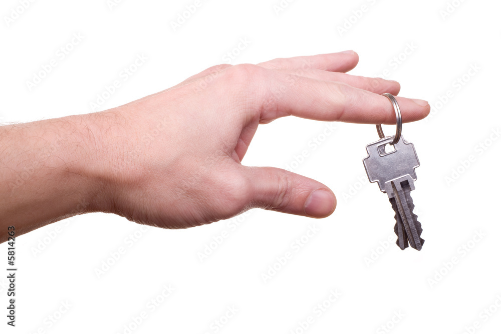 male hand with hanging house key on finger isolated on white male hand with hanging house key on finger isolated on white