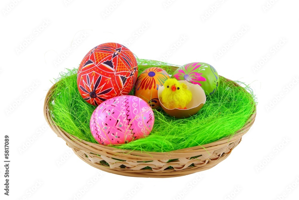 Fototapeta premium Easter eggs in basket on white background