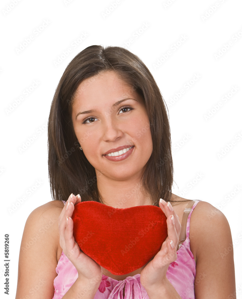 Beautiful young brunette holding a red plush heart shape. Beautiful young brunette holding a red plush heart shape.
